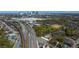 Aerial view of the city featuring train tracks, roads, trees, and buildings under a clear blue sky at 898 Oak Sw St # 3207, Atlanta, GA 30310
