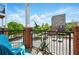 Balcony view with black metal railing, brick supports, and blue patio furniture at 898 Oak Sw St # 3207, Atlanta, GA 30310