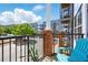 Sunny balcony with black metal railings, brick supports, and a view of the street at 898 Oak Sw St # 3207, Atlanta, GA 30310