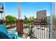 Balcony view with black metal railing, brick supports, and blue patio furniture at 898 Oak Sw St # 3207, Atlanta, GA 30310