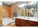 Bathroom featuring double vanity, tile floors, shower and tub combination at 898 Oak Sw St # 3207, Atlanta, GA 30310
