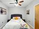 Cozy bedroom with neutral walls, decorative art, and soft lighting from ceiling fan at 898 Oak Sw St # 3207, Atlanta, GA 30310