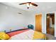 Bedroom with hardwood floors, neutral walls, and a colorful bedspread at 898 Oak Sw St # 3207, Atlanta, GA 30310
