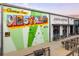 Exterior view of coffee shop and storefront with colorful West End mural art at 898 Oak Sw St # 3207, Atlanta, GA 30310