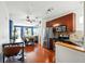 Modern kitchen open to dining area featuring stainless steel appliances, granite counters, and hardwood floors at 898 Oak Sw St # 3207, Atlanta, GA 30310