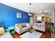 Stylish living room with hardwood floors, blue accent wall, and modern decor throughout at 898 Oak Sw St # 3207, Atlanta, GA 30310