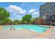 Inviting community pool, lounge seating, and lush greenery at 898 Oak Sw St # 3207, Atlanta, GA 30310