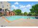 Community pool with lounge chairs and shade with greenery in the background at 898 Oak Sw St # 3207, Atlanta, GA 30310