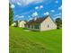 Manicured backyard with a patio, and lush lawn at 1220 Skipping Rock Sw Ln, Grayson, GA 30017