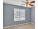 Bedroom featuring a window and ceiling fan at 1220 Skipping Rock Sw Ln, Grayson, GA 30017