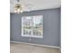 Bedroom featuring a large window overlooking the front yard at 1220 Skipping Rock Sw Ln, Grayson, GA 30017