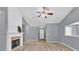 Open living space with a fireplace and view of the entry door at 1220 Skipping Rock Sw Ln, Grayson, GA 30017