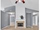 Cozy living room highlighted by a fireplace and open doorways at 1220 Skipping Rock Sw Ln, Grayson, GA 30017