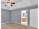 Spacious main bedroom boasts trey ceilings, ceiling fan, and ensuite bathroom entrance at 1220 Skipping Rock Sw Ln, Grayson, GA 30017