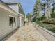 Stone back patio with a view of the yard and surrounding greenery at 2478 Roseberry Ln, Grayson, GA 30017