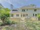 Large backyard featuring a stone patio, outdoor kitchen and plenty of room to play at 2478 Roseberry Ln, Grayson, GA 30017