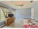 Bedroom features a ceiling fan, natural light, and painted blue walls at 2478 Roseberry Ln, Grayson, GA 30017