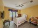 Bright bedroom with ceiling fan, TV and window with decorative valance at 2478 Roseberry Ln, Grayson, GA 30017