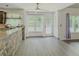Bright breakfast nook with stone accent wall and access to the backyard at 2478 Roseberry Ln, Grayson, GA 30017