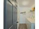 Functional laundry room features washer, dryer, and storage shelving at 2478 Roseberry Ln, Grayson, GA 30017