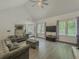 Spacious living room with hardwood floors, fireplace, and large windows at 2478 Roseberry Ln, Grayson, GA 30017