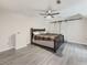 Charming primary bedroom featuring barn doors and contemporary flooring at 2478 Roseberry Ln, Grayson, GA 30017