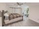 Spacious primary bedroom featuring sliding barn doors, ensuite bathroom, and contemporary flooring at 2478 Roseberry Ln, Grayson, GA 30017