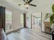 Office space features luxury vinyl plank flooring and natural light from adjacent windows at 2478 Roseberry Ln, Grayson, GA 30017
