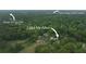 Aerial view of McAfee property near East Lake Golf Course and Barker Bryant Park at 2484 Mcafee Rd, Decatur, GA 30032