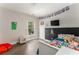 Bedroom with hardwood flooring, built-in chalkboard, and ample natural light at 2484 Mcafee Rd, Decatur, GA 30032