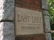 Elegant stone sign marking the entrance to East Lake established in 1892 at 2484 Mcafee Rd, Decatur, GA 30032
