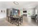 Open-concept living and dining area with hardwood floors and modern decor at 2484 Mcafee Rd, Decatur, GA 30032