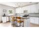 Modern kitchen boasts stainless steel appliances, black countertops, an island, and stylish backsplash at 2484 Mcafee Rd, Decatur, GA 30032