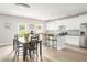 Bright, open kitchen features stainless steel appliances, island, and ample cabinet space at 2484 Mcafee Rd, Decatur, GA 30032