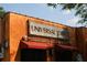 Unique restaurant with a striking orange facade and red awnings, a lively spot to dine at 2484 Mcafee Rd, Decatur, GA 30032