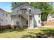 Backyard featuring a stairwell to the second story and green yard space, with a view of the home at 2553 Creekwood Ter, Decatur, GA 30030