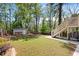 Large backyard features a shed with wooden benches and stairs to the second story at 2553 Creekwood Ter, Decatur, GA 30030