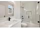 Modern bathroom featuring a glass door shower, marble countertop vanity and streamlined fixtures and finishes at 2553 Creekwood Ter, Decatur, GA 30030