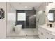 Modern bath features a soaking tub, shower, and a double sink vanity at 2553 Creekwood Ter, Decatur, GA 30030