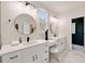 Bathroom with white cabinets, quartz countertop, vanity, and modern fixtures at 2553 Creekwood Ter, Decatur, GA 30030