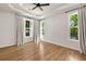 Spacious bedroom features hardwood floors, tray ceilings and two windows with backyard views at 2553 Creekwood Ter, Decatur, GA 30030
