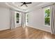 Bright bedroom with hardwood floors, tray ceiling, and many windows at 2553 Creekwood Ter, Decatur, GA 30030