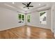 Bright bedroom with tray ceiling, hardwood flooring, and multiple windows providing great natural light at 2553 Creekwood Ter, Decatur, GA 30030