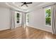 Empty bedroom with wood floors, neutral walls, and large windows at 2553 Creekwood Ter, Decatur, GA 30030