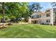 Charming two-story home featuring a well-manicured lawn and inviting front porch at 2553 Creekwood Ter, Decatur, GA 30030