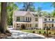 Elegant two-story home boasts a spacious driveway and manicured landscaping at 2553 Creekwood Ter, Decatur, GA 30030