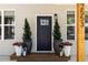 Close up of a stylish front door with decorative plants and modern house number at 2553 Creekwood Ter, Decatur, GA 30030