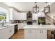 Modern kitchen featuring white cabinets, stainless steel appliances, and a stylish island at 2553 Creekwood Ter, Decatur, GA 30030