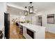 Open concept kitchen with large island, hardwood floors and stainless steel appliances at 2553 Creekwood Ter, Decatur, GA 30030