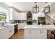 Modern kitchen featuring white cabinetry, stainless steel appliances, and center island at 2553 Creekwood Ter, Decatur, GA 30030
